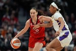 Portland Fire guard Carla Leite (0) drives to the basket during the first half of a WNBA preseason basketball game against the Los Angeles Sparks, Sunday, May 3, 2026, in Portland, Ore.