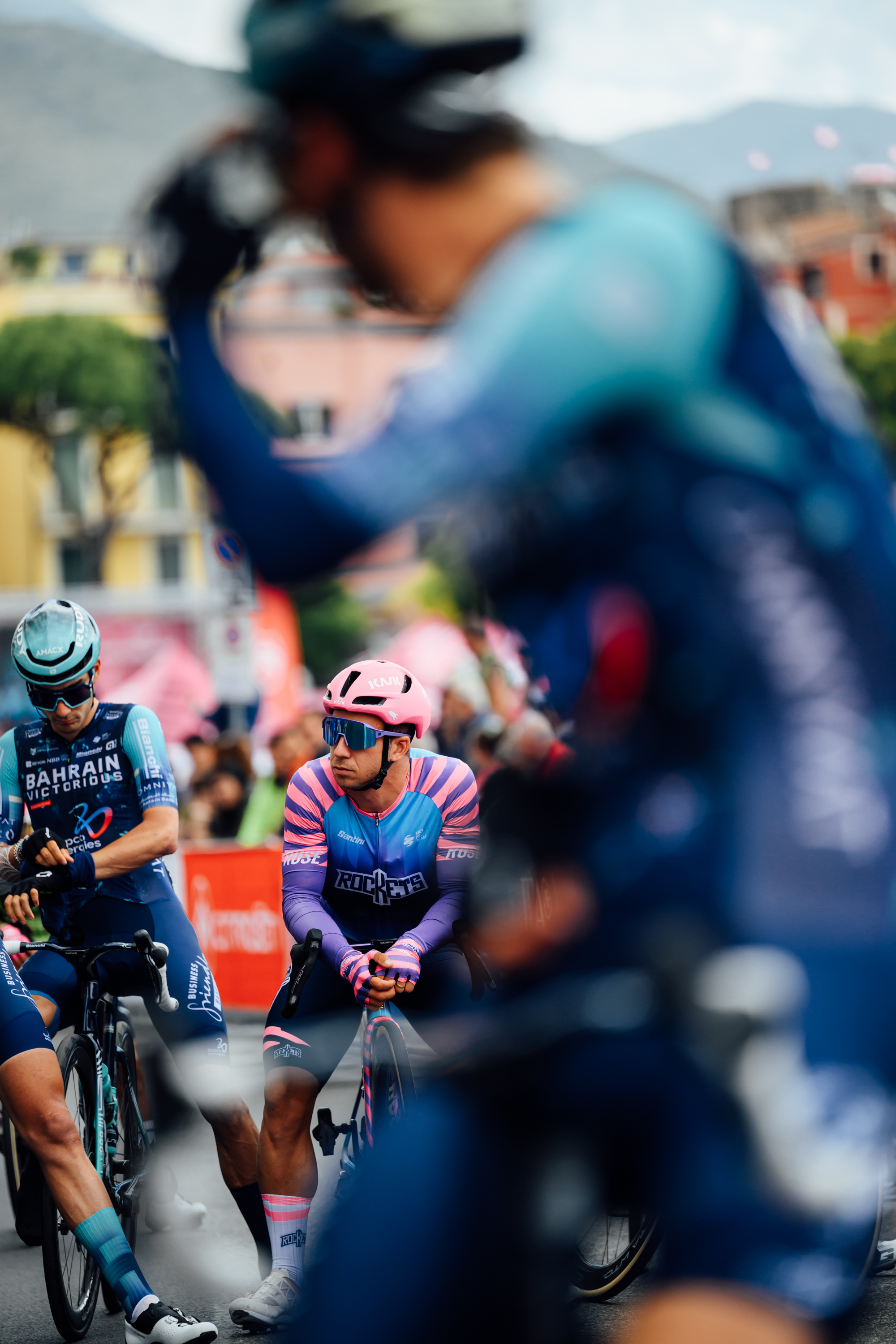 Riders line up waiting to start the race among fans and crowds at the start line. Images from 2026 Giro d'Italia stage 7 to Blockhaus