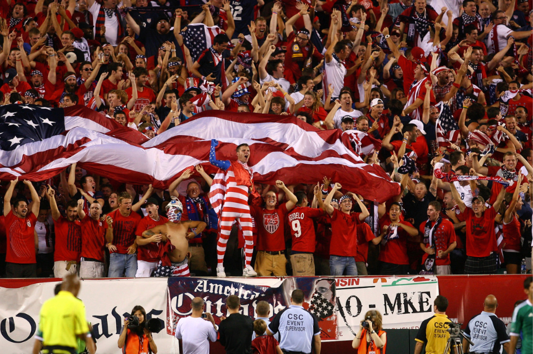 Soccer supporters brandishing American flag