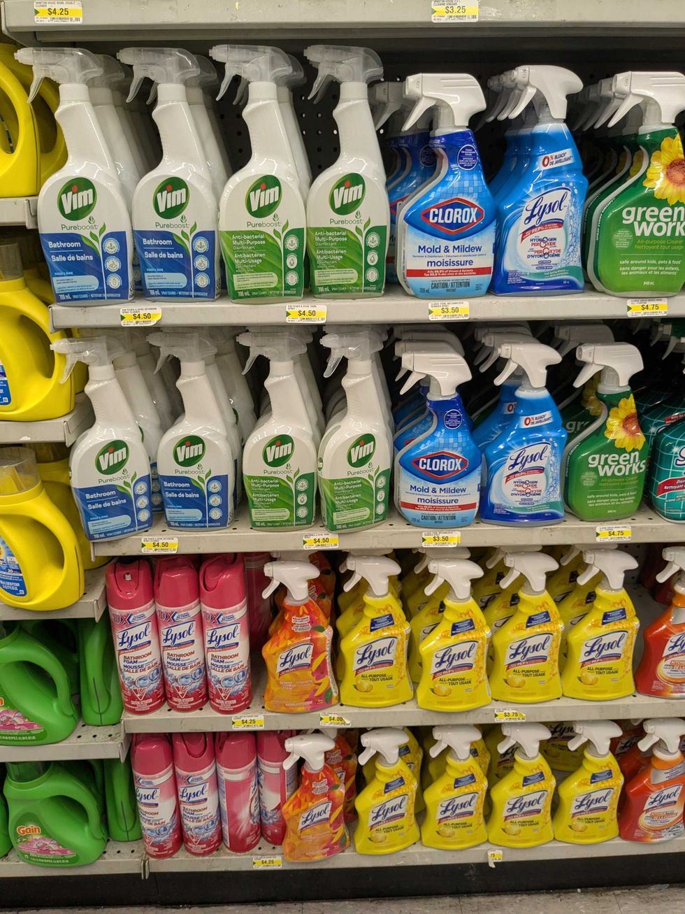A large shelf full of cleaning supplies