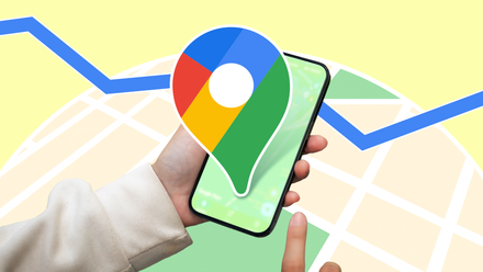A person holding a smartphone with the Google Maps logo enlarged over the screen, set against a stylized map background with a blue navigation route line running across it.
