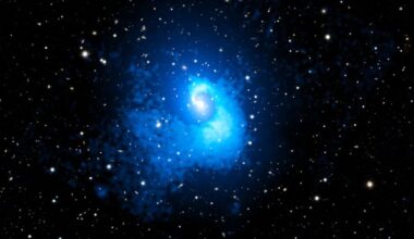 Abell 2029 is a large galaxy cluster that contains more than 1,000 galaxies. It's one of the large clusters we know of and appears to be calm and relaxed. But Chandra x-ray observations reveal evidence of a massive merger event about 4 billion years ago. Image Credit: X-ray: NASA/CXC/CfA/C. Watson et al.; Optical: PanSTARRS; Image Processing: NASA/CXC/SAO/N. Wolk and P. Edmonds
