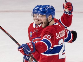 Montreal Canadiens' Juraj Slafkovsky celebrates with Cole Caufield after scoring against the Buffalo Sabres during second period of Game 3 of National Hockey League playoff series in Montreal, Sunday May 10, 2026.