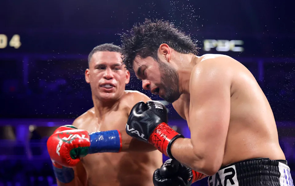 LAS VEGAS, NEVADA - MAY 02: WBA/WBO cruiserweight champion Gilberto Ramirez takes a punch from David Benavidez during a title fight at T-Mobile Arena on May 02, 2026 in Las Vegas, Nevada. Benavidez took the titles with a sixth-round TKO. (Photo by Steve Marcus/Getty Images)
