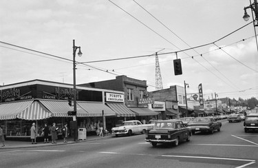 1968: The intersection of Yew Street and West 41st Avenue and buildings on the 2100 block of West 41st Avenue, including Vanity Lingerie and Hosiery, Purdy's Chocolates, Felix Market, B&B Hardware, Finn's Ladies and Men's Clothiers, and the Cookie Jar.