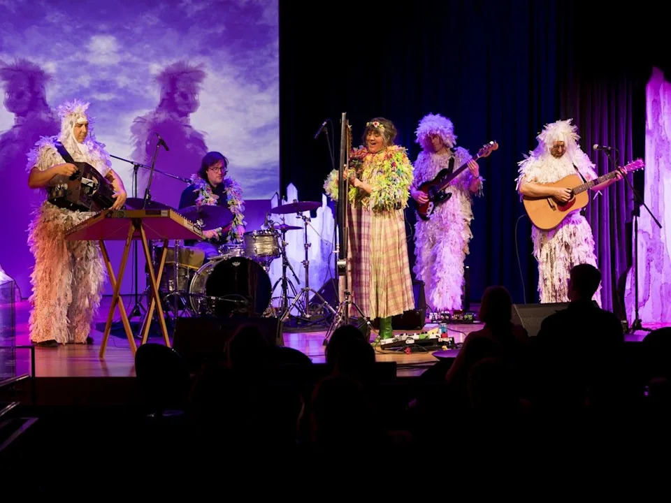 Inside the Heather Edwards Theatre, Hermitess and her four-piece band perform within “The Hermits’ Cavern” art activation.