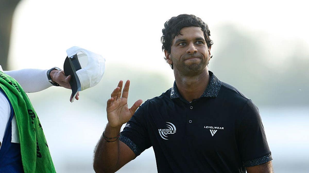 Aaron Rai of England acknowledges the crowd