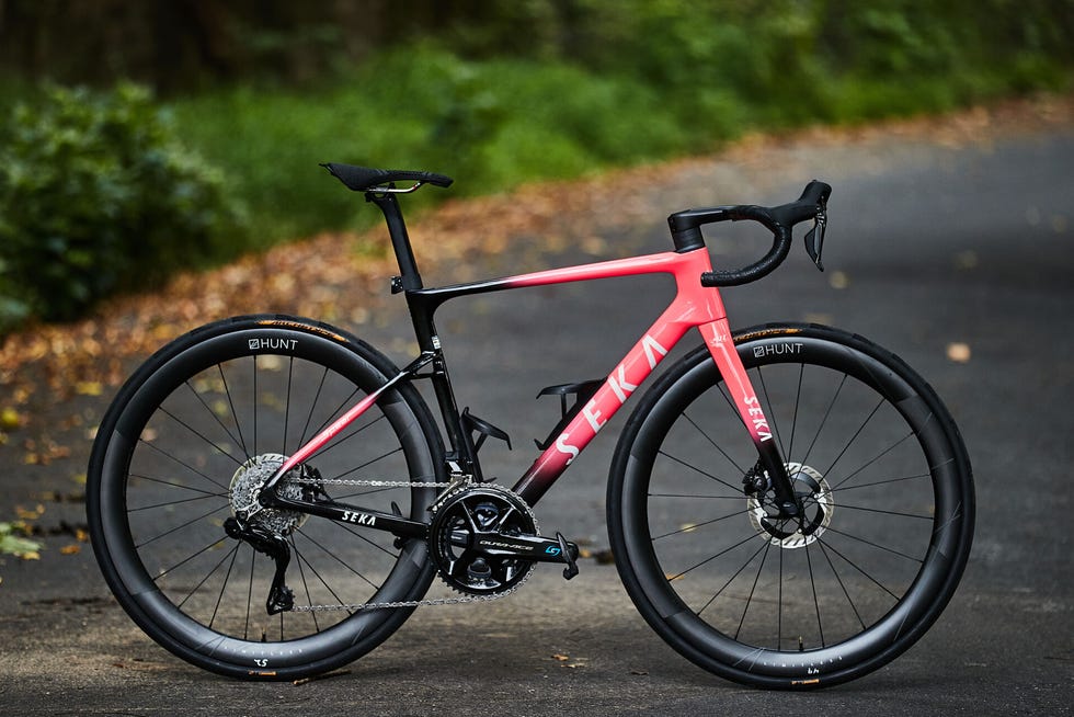 Road bike positioned on a pathway surrounded by greenery. Road bike positioned on a pathway surrounded by greenery.