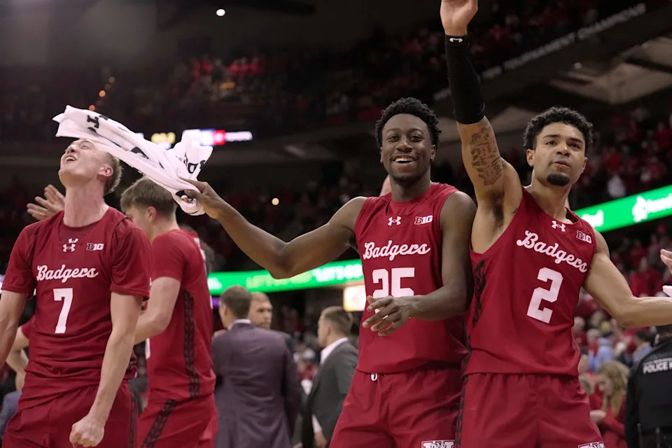 Wisconsin guard John Blackwell (25) and guard Nick Boyd (2) are shown during the waning moment of their game Saturday, December 6, 2025 at the Kohl Center in Madison, Wisconsin. Wisconsin beat Marquette 96-76.