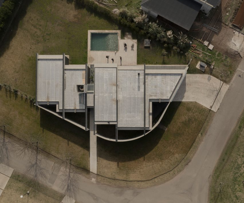 Casa Alba by Ademas Arquitectura, a concrete house with a wall for privacy