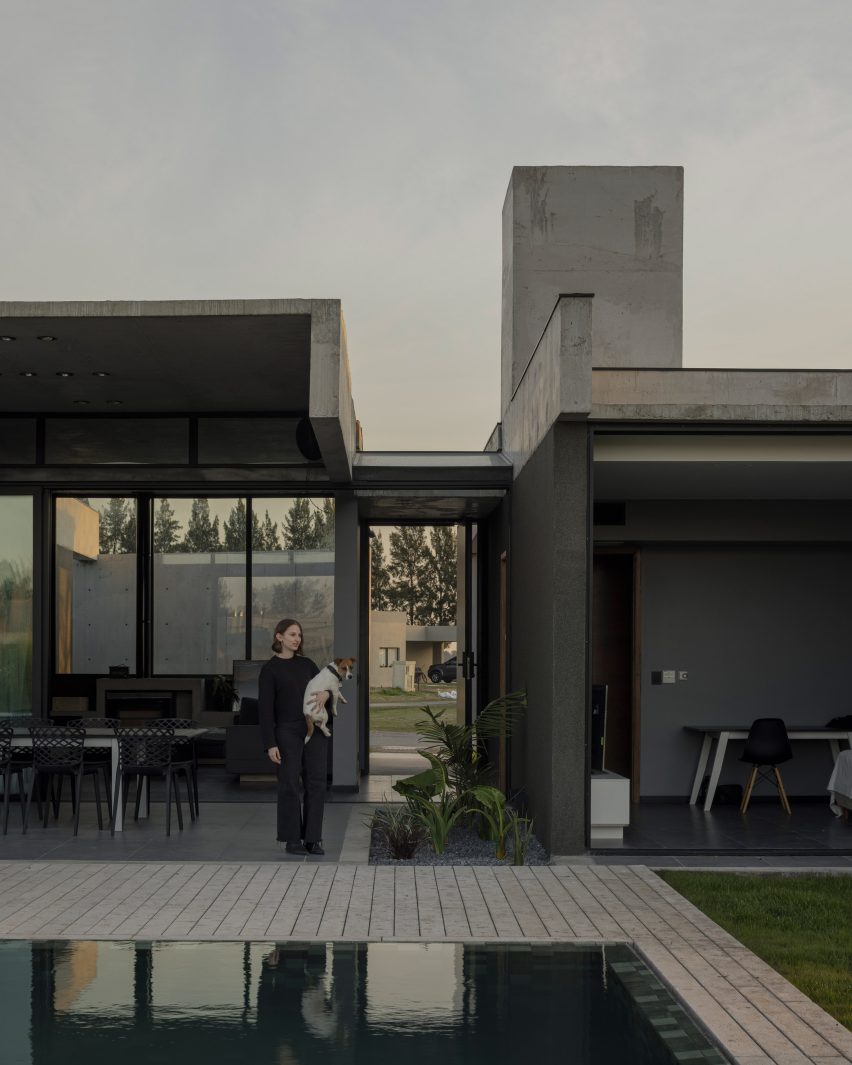 Casa Alba by Ademas Arquitectura, a concrete house with a wall for privacy