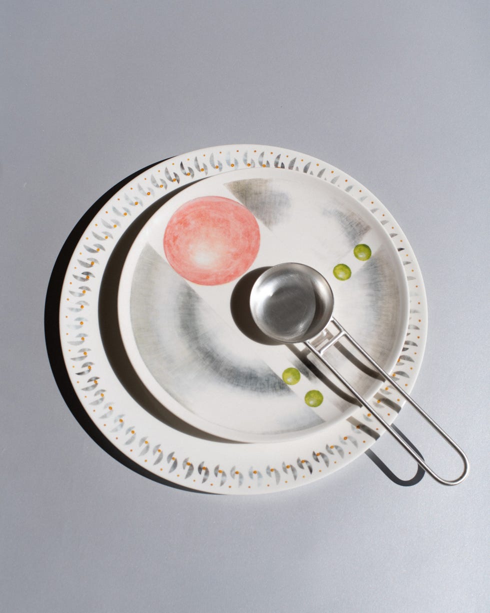 Decorative plates with a spoon, featuring abstract designs.