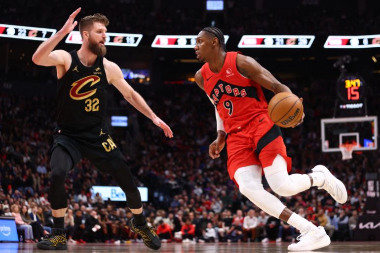 TORONTO, CANADA - MAY 01: RJ Barrett #9 of the Toronto Raptors drives to the basket against Dean Wade #32 of the Cleveland Cavaliers during the third quarter in Game Six of the First Round of the NBA Eastern Conference Playoffs at Scotiabank Arena on May 01, 2026 in Toronto, Ontario, Canada. NOTE TO USER: User expressly acknowledges and agrees that, by downloading and or using this photograph, User is consenting to the terms and conditions of the Getty Images License Agreement. Cole Burston/Getty Images/AFP (Photo by Cole Burston / GETTY IMAGES NORTH AMERICA / Getty Images via AFP)