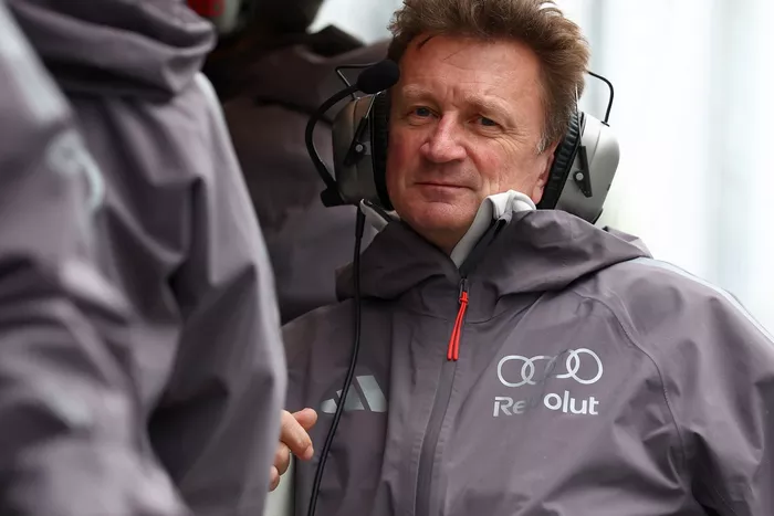 Allan McNish, Racing Director, Audi F1 Team, looks on from the pit wall.