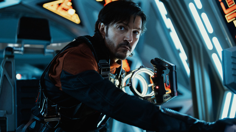 Cassian Andor looks up from a TIE Fighter cockpit in Andor