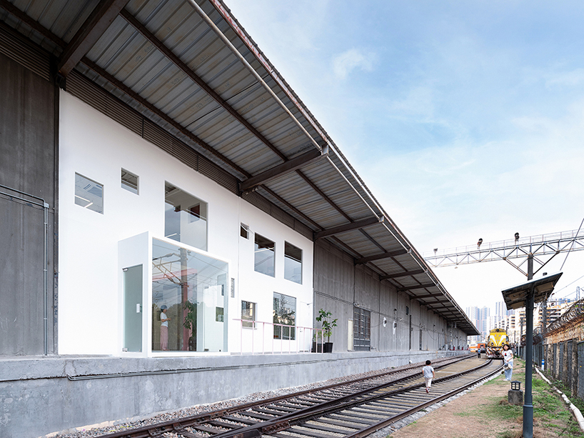 layered transparent walls transform former railway warehouse in shenzhen - 2
