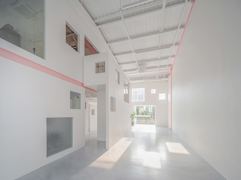 layered transparent walls transform former railway warehouse in shenzhen - 4