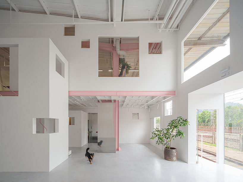 layered transparent walls transform former railway warehouse in shenzhen - 6