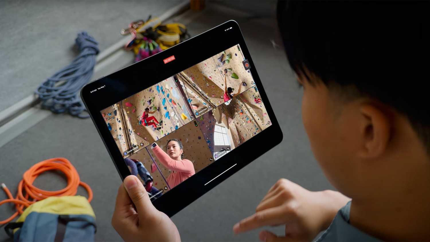 A person looks down at an iPad with Final Cut's Live Multicam feature.