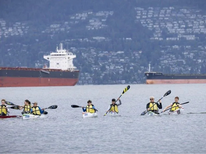 Phil Skinder (second from right) from the Pacific Lifesaving Club with students at Jericho Beach in Vancouver.