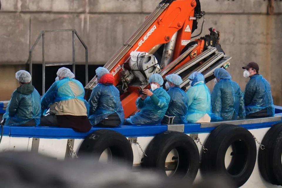 Passengers are disembarked from the hantavirus-stricken cruise ship MV Hondius at the port of Granadilla in Tenerife, Canary Islands, Spain, Sunday, May 10, 2026. (AP Photo/Manu Fernandez)