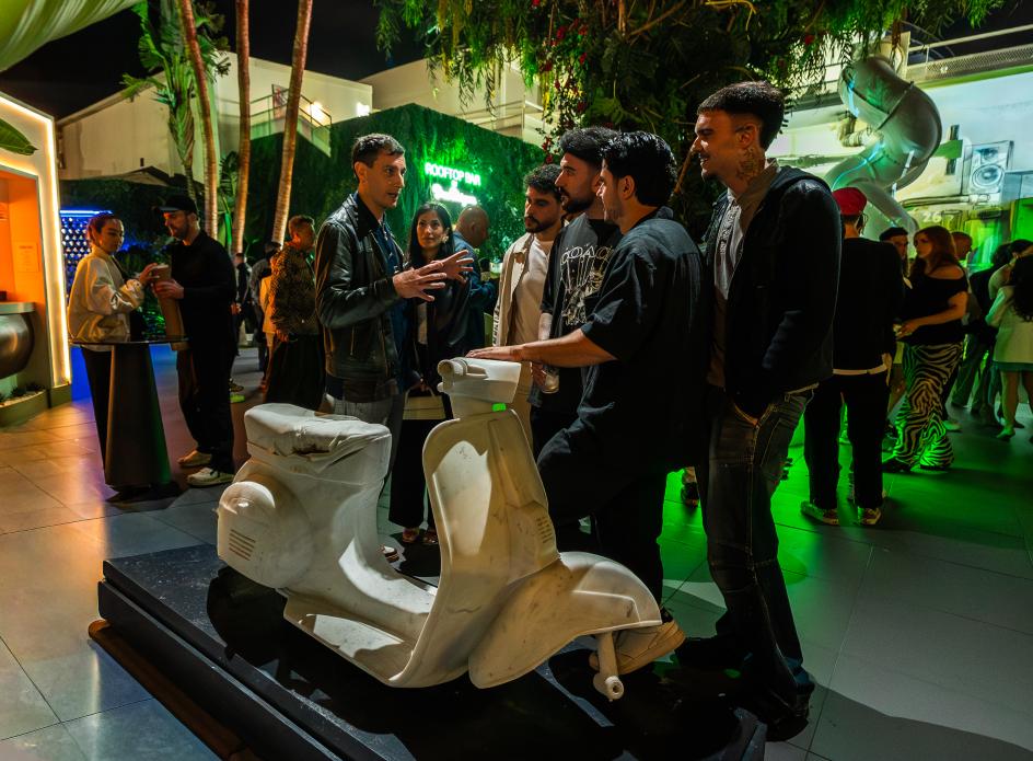 Italian sculptor Nazareno Biondo with his marble sculpture of a Vespa at Hï Ibiza