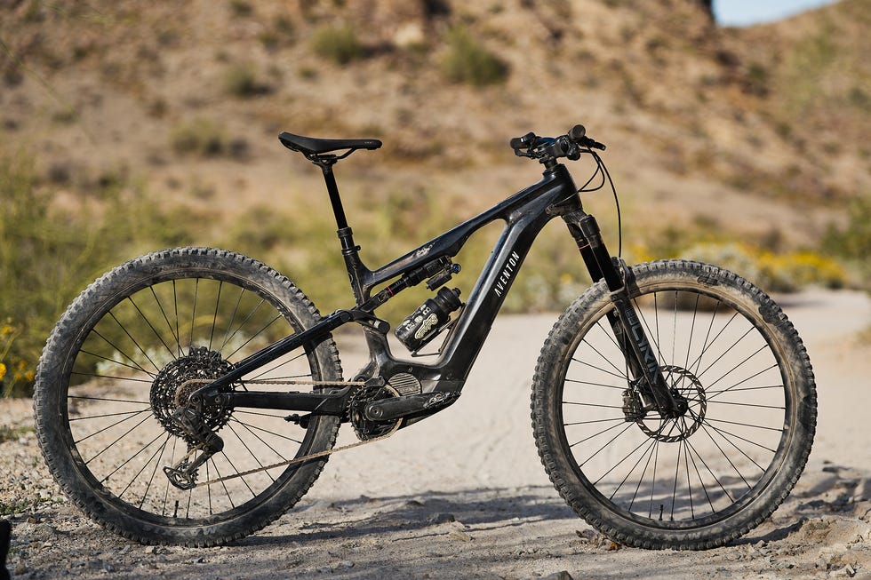 Mountain bike parked on a dirt trail in a desert landscape. Mountain bike parked on a dirt trail in a desert landscape.
