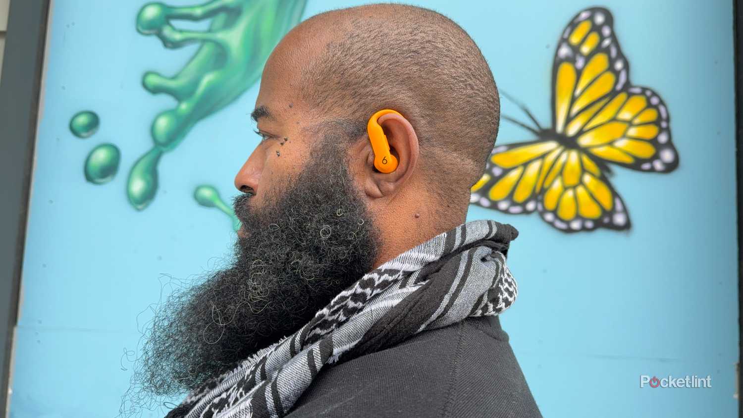 Reviewer wearing Powerbeats Pro 2.