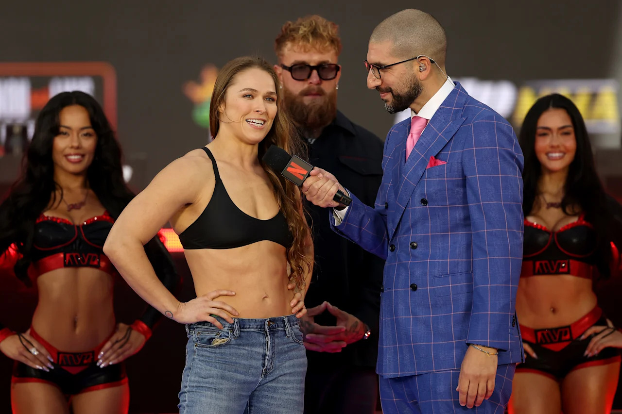 INGLEWOOD, CALIFORNIA - MAY 15: Ariel Helwani interviews Ronda Rousey during the Weigh-In for Netflix's Ronda Rousey vs. Gina Carano at Intuit Dome on May 15, 2026 in Inglewood, California. (Photo by Sarah Stier/Getty Images for Netflix)