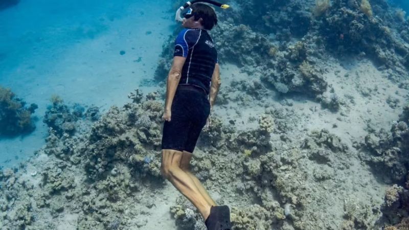 A crocodile crushed his only functional arm. He returned to the to water to fight plastic pollution