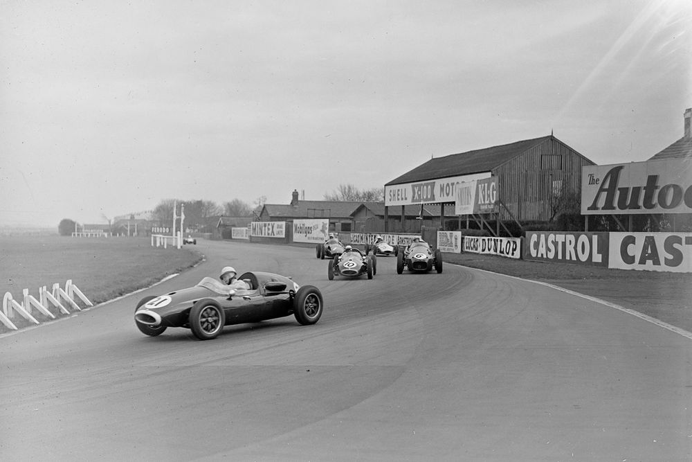 McLaren drove a loaned 
works Cooper at the Aintree 200 F1/F2 race in 1958