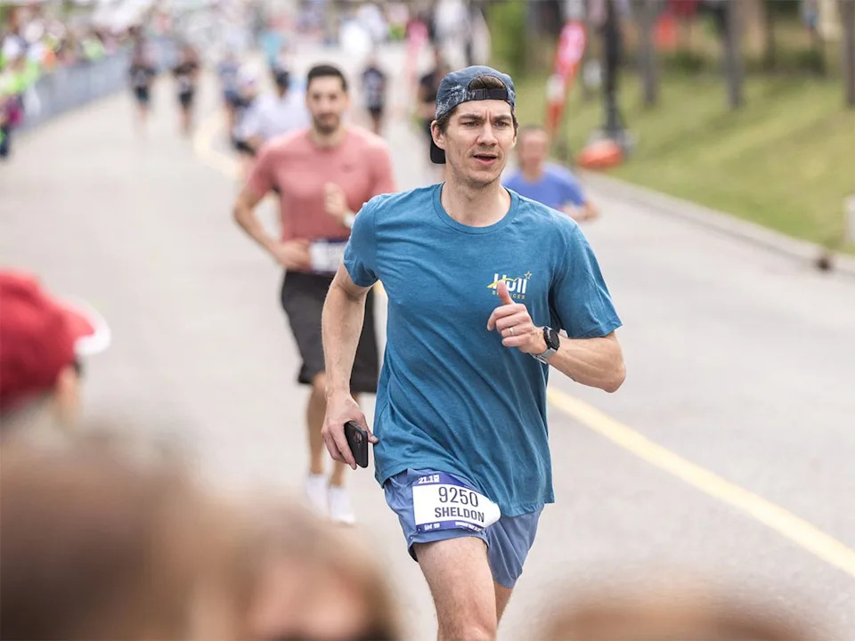 Sheldon Smith approaches the finish line in the 21.1 km event of the Servus Calgary Marathon on Sunday, May 24, 2026. Smith was fundraising for Hull Services, which provides mental health supports to young people.