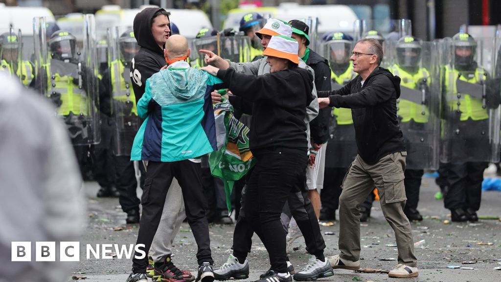 Police pelted with bottles as Celtic fans celebrate Scottish Premiership title in Glashow's east end - BBC