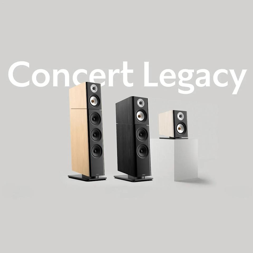 Three modern floor-standing and bookshelf speakers in light wood and black finishes on a gray background with "Concert Legacy" text.