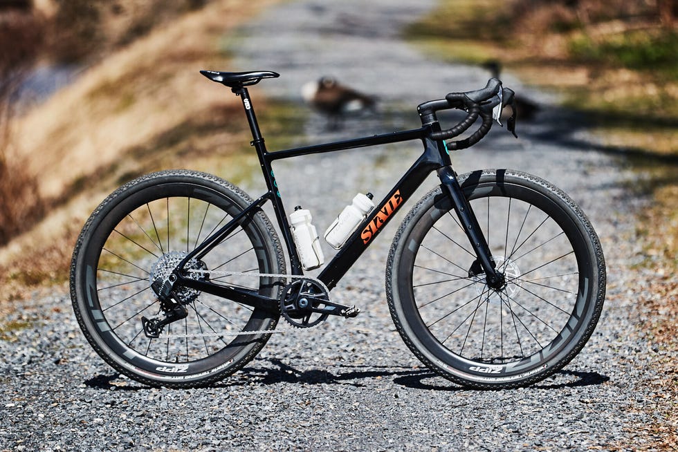 Bicycle positioned on a gravel path Bicycle positioned on a gravel path
