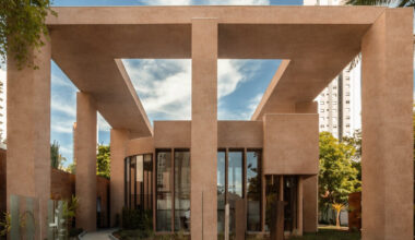 monochromatic concrete geometry shapes temporary pavilion in são paulo
