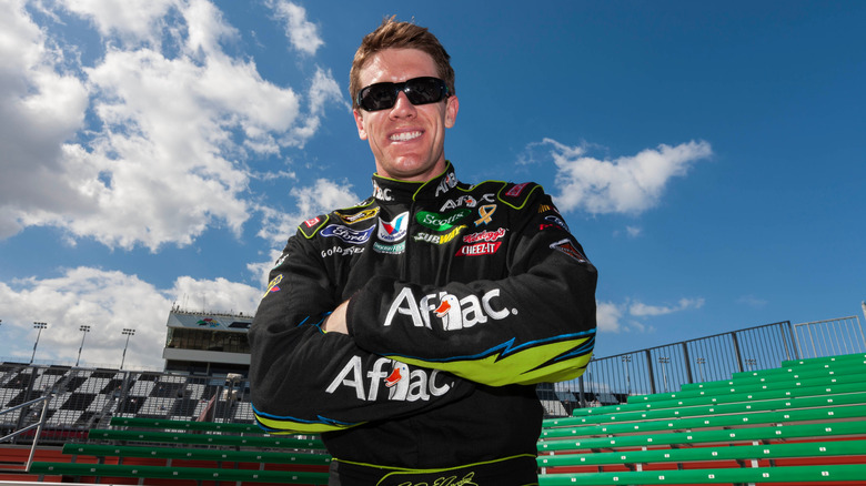 Carl Edwards posing for pictures before a NASCAR race