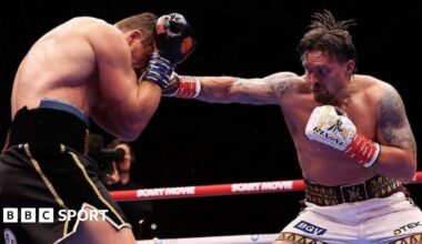 Referee Mark Lyson stops the fight as Oleksandr Usyk walks away