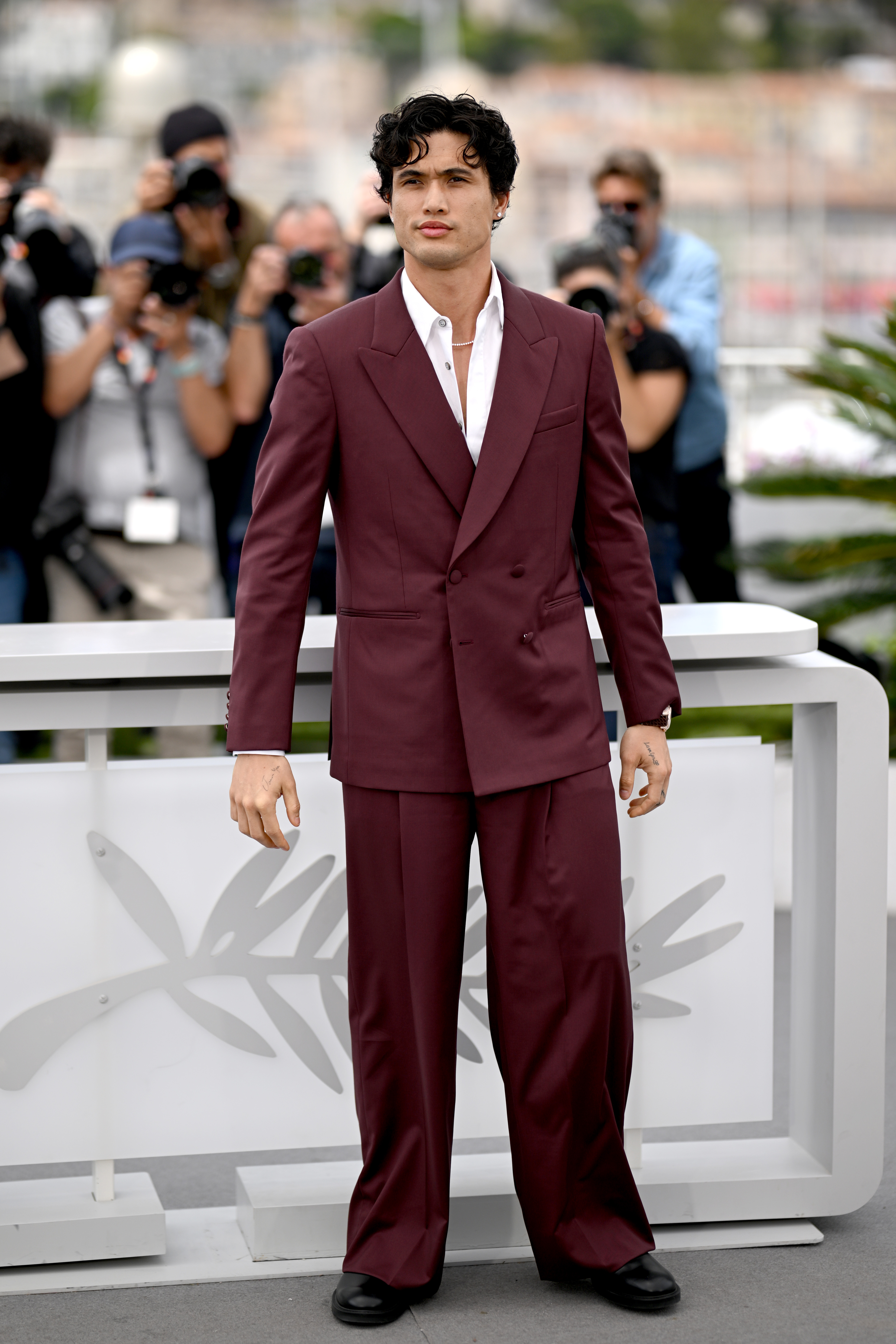 Charles Melton wearing Louis Vuitton