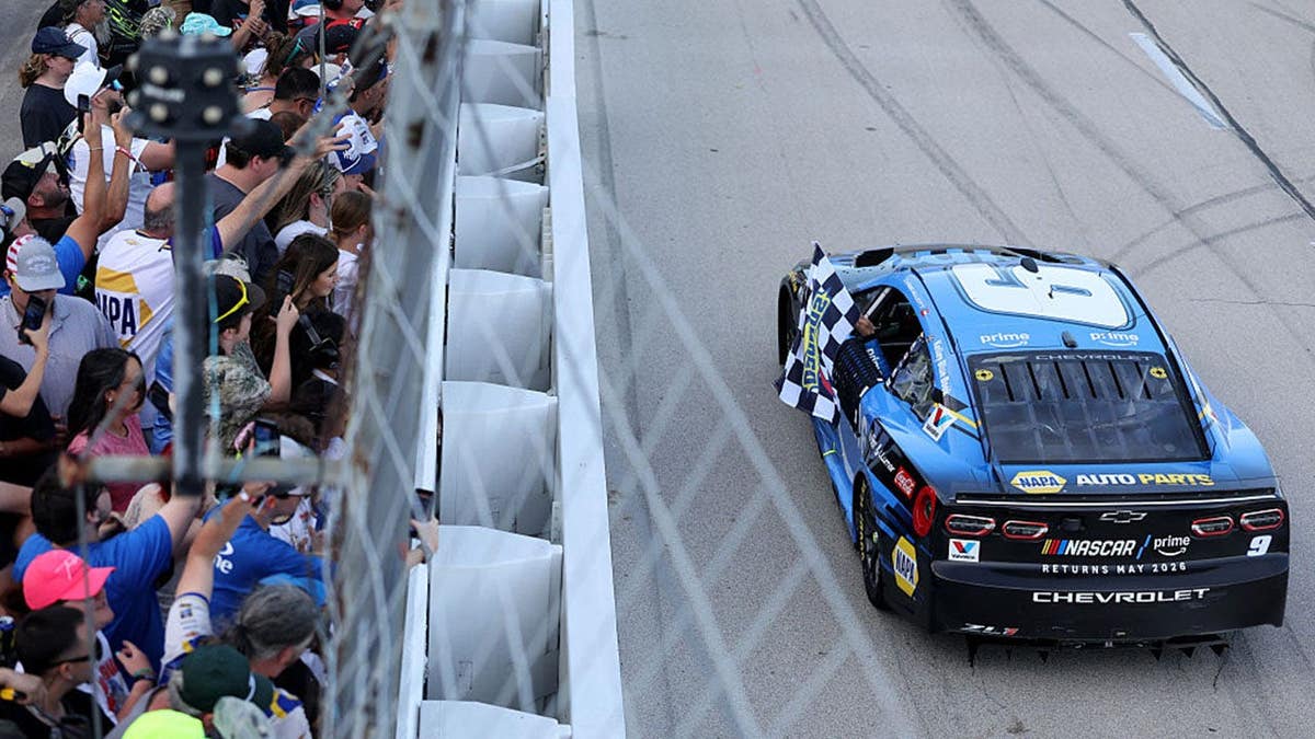 Chase Elliott celebrating victory at Texas Motor Speedway