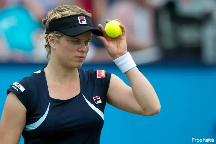 Kim Clijsters holds visor