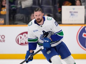 Vancouver Canucks defenceman Filip Hronek (17) warms up before a game against the Nashville Predators on Oct. 23, 2025, in Nashville, Tenn.