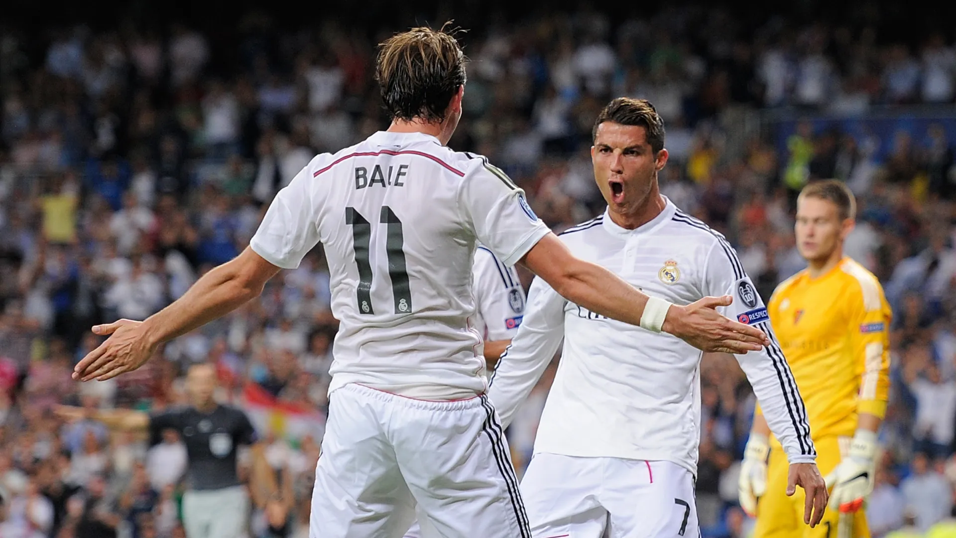 Cristiano Ronaldo of Real Madrid celebrates with Gareth Bale after scoring Real's 3rd goal against FC Basel 1893.