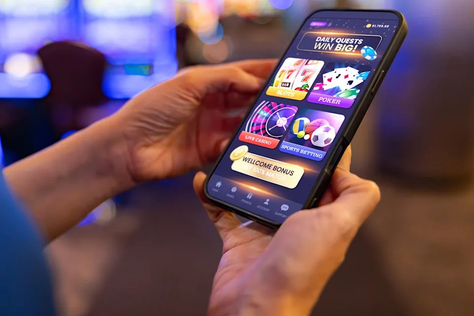 Stock image of someone using a gambling appCredit: Getty