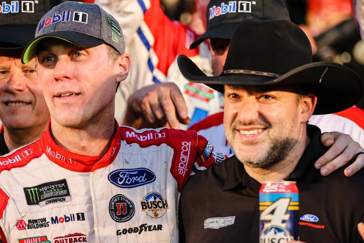 An image of NASCAR legends Tony Stewart and Kevin Harvick celebrating a Cup win for the latter