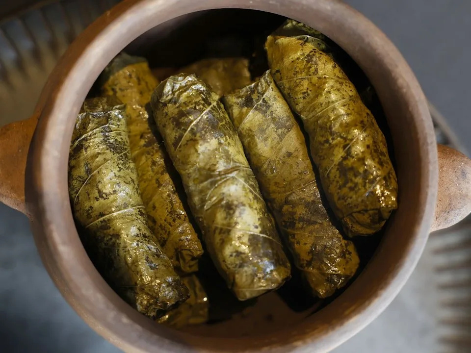 Tolma are grape leaves stuffed with rice and beef at Yan’s Restaurant on Murray Street.
