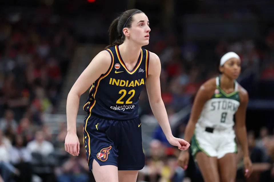 INDIANAPOLIS, INDIANA – MAY 17: Caitlin Clark #22 of the <a class="link " href="https://sports.yahoo.com/wnba/teams/indiana/" data-i13n="sec:content-canvas;subsec:anchor_text;elm:context_link" data-ylk="slk:Indiana Fever;sec:content-canvas;subsec:anchor_text;elm:context_link;itc:0" data-yga="{"yLinkElement":"context_link","yModuleName":"content-canvas","yLinkText":"Indiana Fever","ySubModuleName":"anchor_text","yHasCommerce":false}">Indiana Fever</a> against the <a class="link " href="https://sports.yahoo.com/wnba/teams/seattle/" data-i13n="sec:content-canvas;subsec:anchor_text;elm:context_link" data-ylk="slk:Seattle Storm;sec:content-canvas;subsec:anchor_text;elm:context_link;itc:0" data-yga="{"yLinkElement":"context_link","yModuleName":"content-canvas","yLinkText":"Seattle Storm","ySubModuleName":"anchor_text","yHasCommerce":false}">Seattle Storm</a> at Gainbridge Fieldhouse on May 17 2026 in Indianapolis, Indiana. (Photo by Andy Lyons/Getty Images)