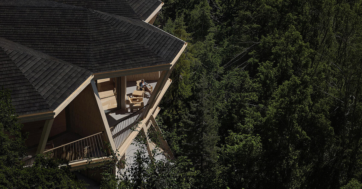 fragmented timber volumes compose forested mountain housing by arup in albania