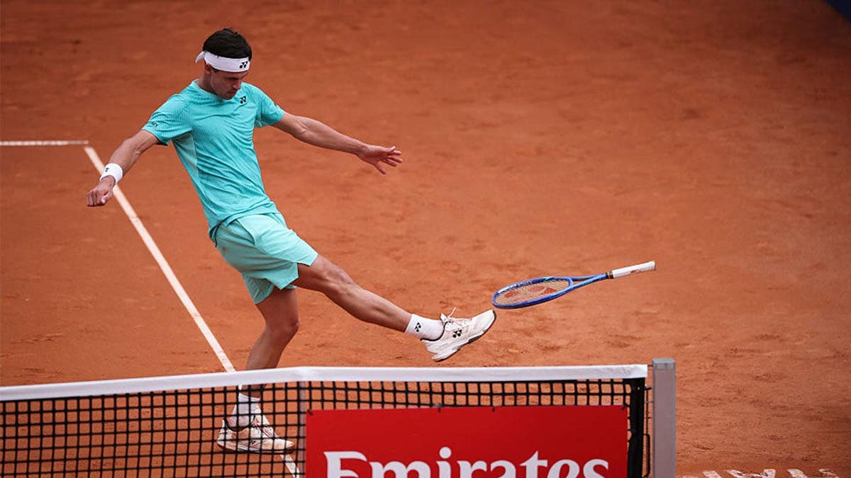 Daniel Altmaier kicks his racket
