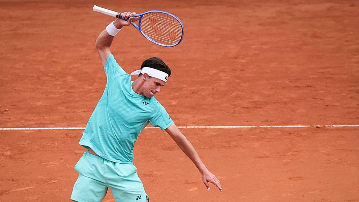 Daniel Altmaier throws his racket